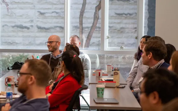 Audience members listening attentively